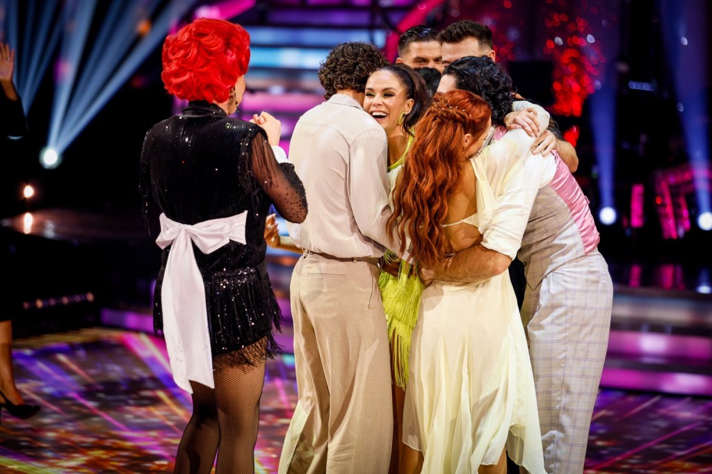 A group of dancers hug Vicky Pattison on the dancefloor